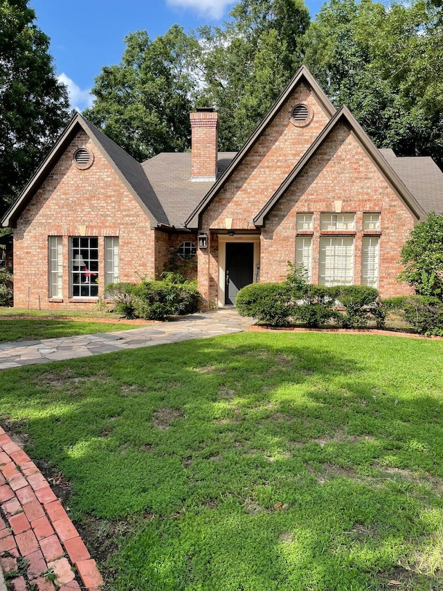 1200 Mary Lee Ln, Crockett, TX 75835 - view of front facade featuring brick siding, a chimney, and a front lawn