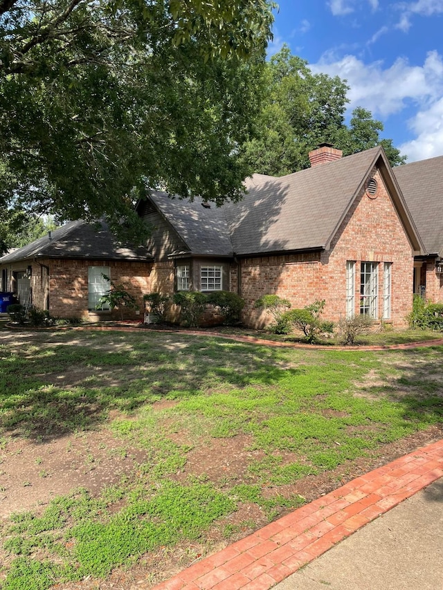 1200 Mary Lee Ln, Crockett, TX 75835 - view of front of house with brick siding, a chimney, and a front yard