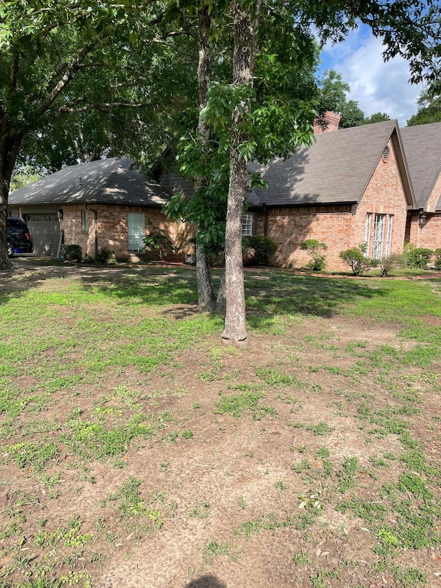 1200 Mary Lee Ln, Crockett, TX 75835 - view of grassy yard featuring a garage
