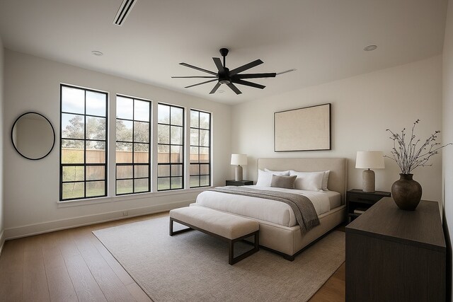 6911 Hartland Ave, Houston, TX 77055 - bedroom with wood finished floors and a ceiling fan
