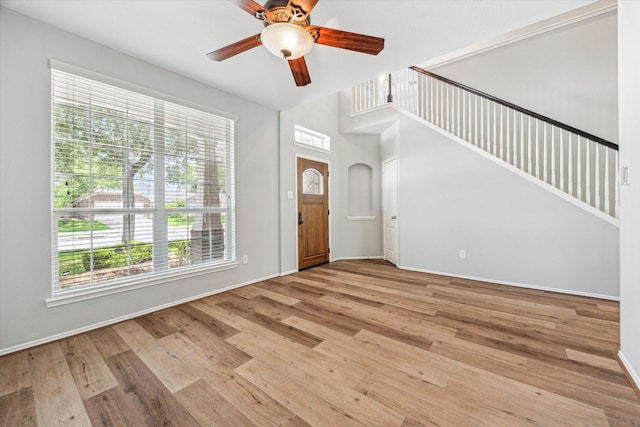2551 Goldeneye Ln, League City, TX 77573 - entryway with healthy amount of natural light, ceiling fan, and light wood-style floors
