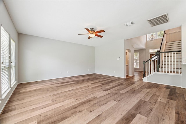 2551 Goldeneye Ln, League City, TX 77573 - empty room featuring healthy amount of natural light, stairway, and wood finished floors