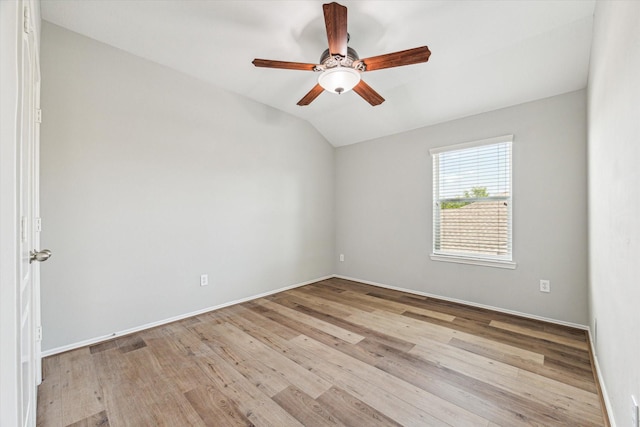 2551 Goldeneye Ln, League City, TX 77573 - spare room featuring vaulted ceiling, a ceiling fan, and light wood-style flooring