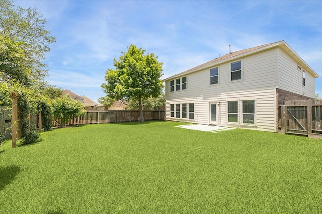 2551 Goldeneye Ln, League City, TX 77573 - back of house featuring a fenced backyard and a patio