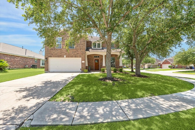 2551 Goldeneye Ln, League City, TX 77573 - traditional-style home with driveway, an attached garage, brick siding, and a front yard