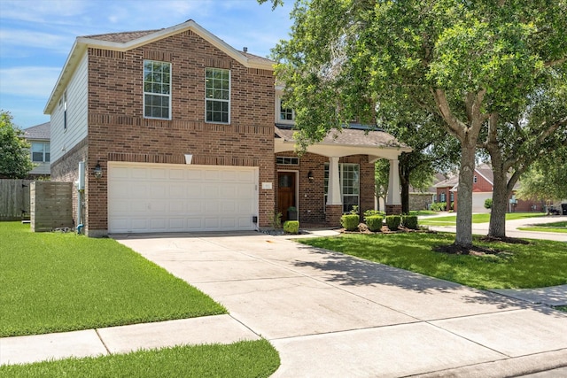 2551 Goldeneye Ln, League City, TX 77573 - view of front facade with brick siding, driveway, a garage, and a porch