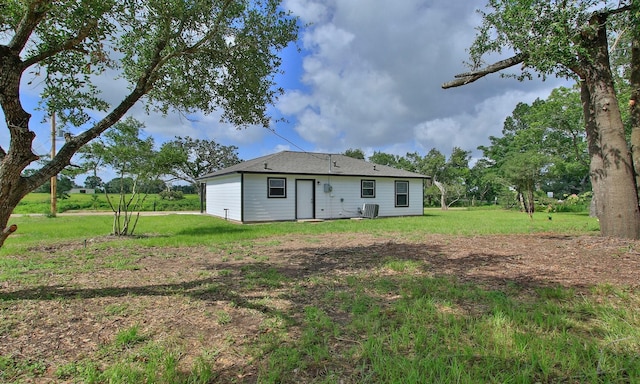 1440 Shepherd St, Hempstead, TX 77445 - back of property featuring a yard