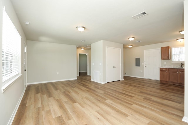 1440 Shepherd St, Hempstead, TX 77445 - unfurnished living room with electric panel and light wood finished floors