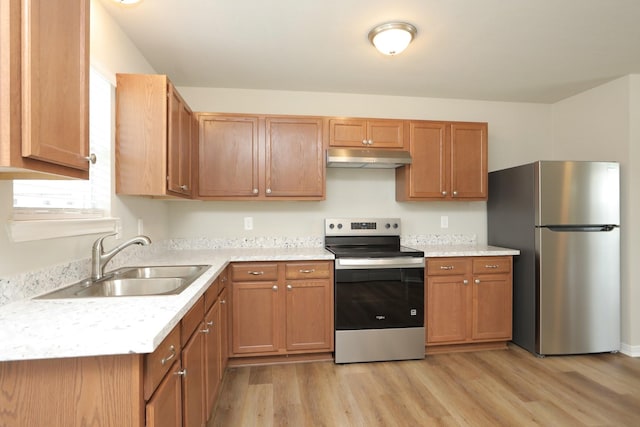 1440 Shepherd St, Hempstead, TX 77445 - kitchen featuring stainless steel appliances, light countertops, and light wood-style floors