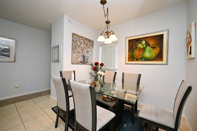 9809 Richmond Ave Unit G1, Houston, TX 77042 - dining room featuring a chandelier and tile patterned flooring