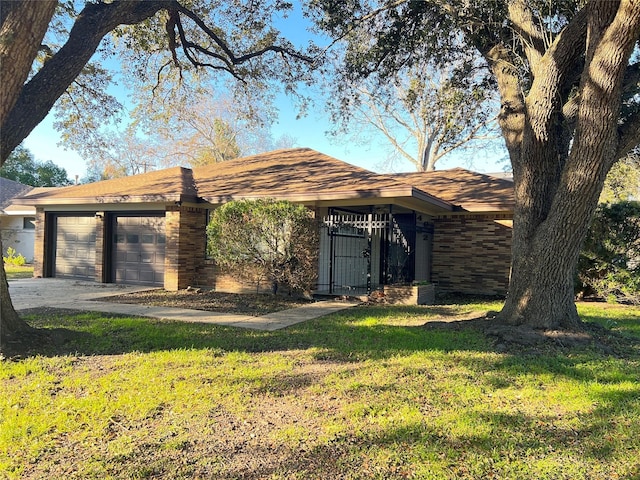 4602 Redstart St, Houston, TX 77035 - ranch-style house with an attached garage, a front lawn, concrete driveway, and brick siding
