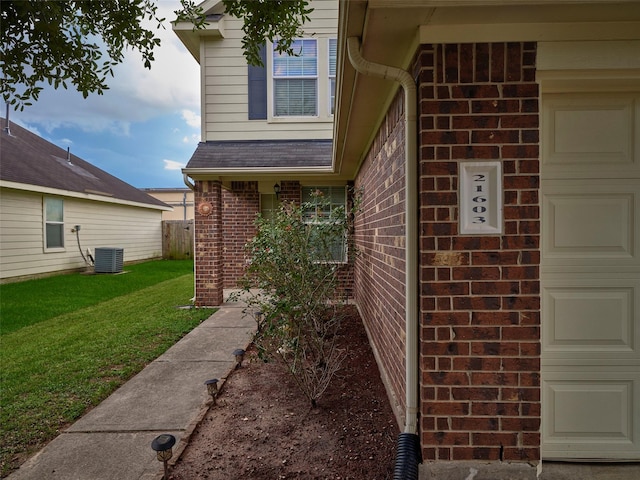 21603 Micheala Way, Humble, TX 77338 - view of property exterior with brick siding, a garage, and a yard