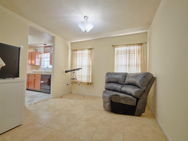 21603 Micheala Way, Humble, TX 77338 - living area featuring light tile patterned floors and baseboards