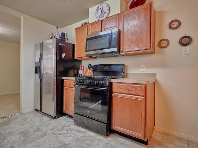 21603 Micheala Way, Humble, TX 77338 - kitchen featuring stainless steel appliances and light countertops