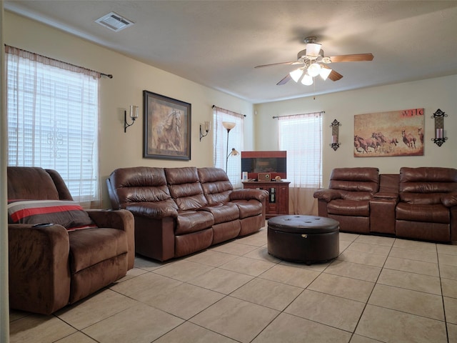 21603 Micheala Way, Humble, TX 77338 - living area featuring light tile patterned floors and ceiling fan