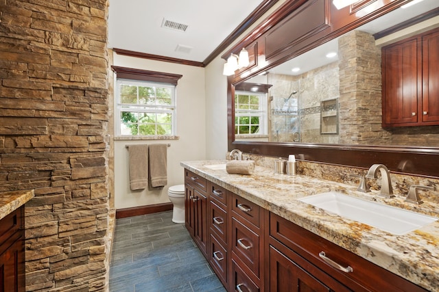 111 Whispering Oaks Dr, Seabrook, TX 77586 - full bathroom with double vanity, crown molding, and a tile shower