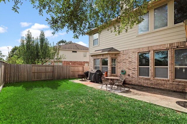14306 Prosper Ridge Dr, Cypress, TX 77429 - fenced backyard with a patio area
