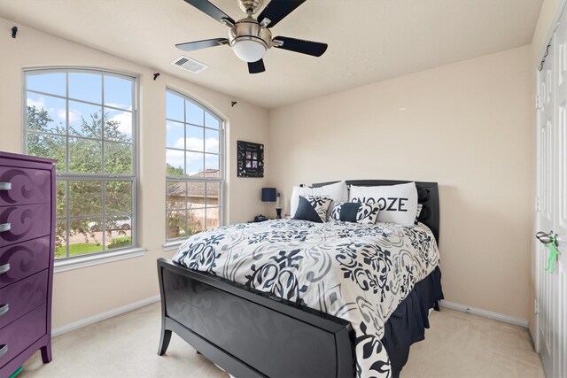 14306 Prosper Ridge Dr, Cypress, TX 77429 - bedroom with light carpet, multiple windows, and a ceiling fan