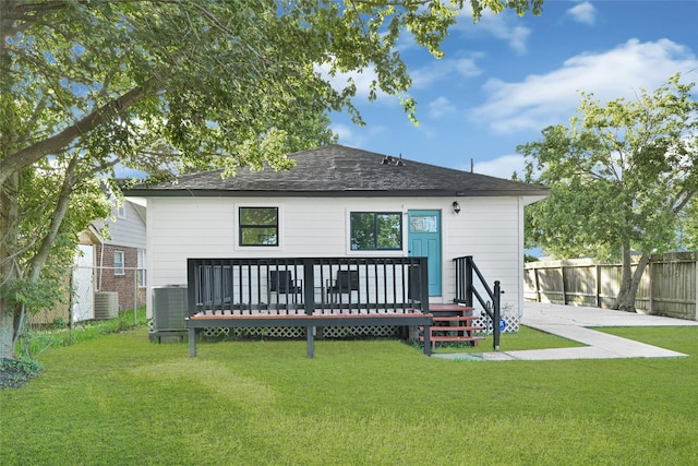 2346 Delafield St, Houston, TX 77023 - rear view of property featuring a fenced backyard, a wooden deck, and a shingled roof