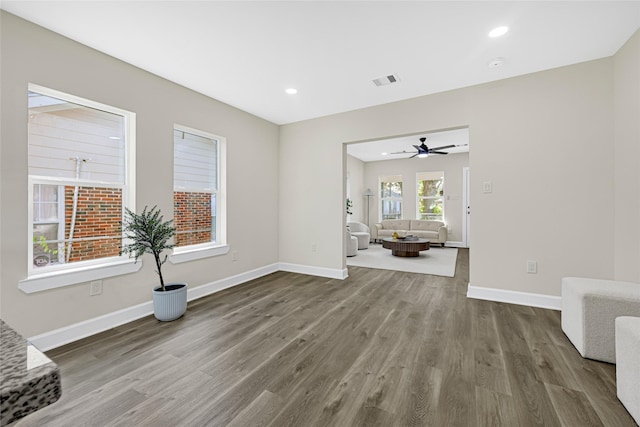 2346 Delafield St, Houston, TX 77023 - unfurnished living room with wood finished floors, recessed lighting, and a ceiling fan