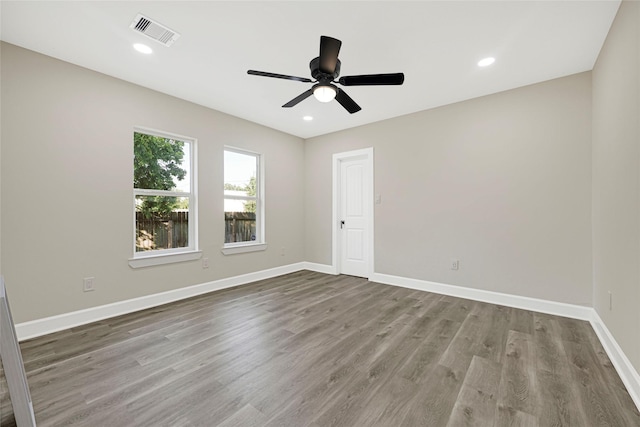 2346 Delafield St, Houston, TX 77023 - spare room featuring wood finished floors, a ceiling fan, and recessed lighting
