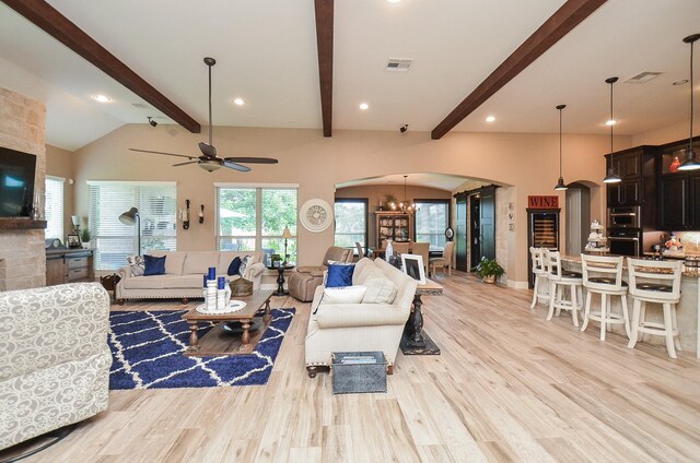 33215 Worthing Ln, Fulshear, TX 77441 - living area featuring arched walkways, light wood-style flooring, a ceiling fan, and recessed lighting