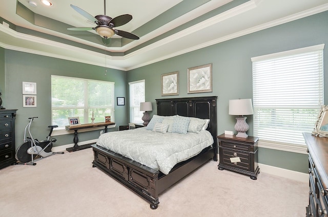 33215 Worthing Ln, Fulshear, TX 77441 - bedroom with light colored carpet, crown molding, a raised ceiling, and a ceiling fan