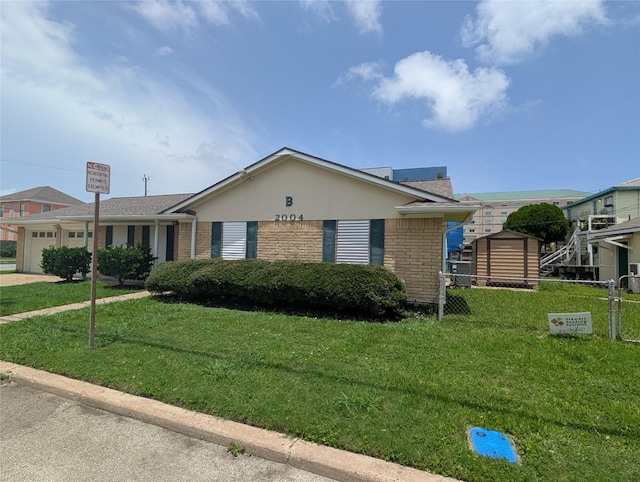 2004 24th St, Galveston, TX 77550 - view of front of house with brick siding and an attached garage