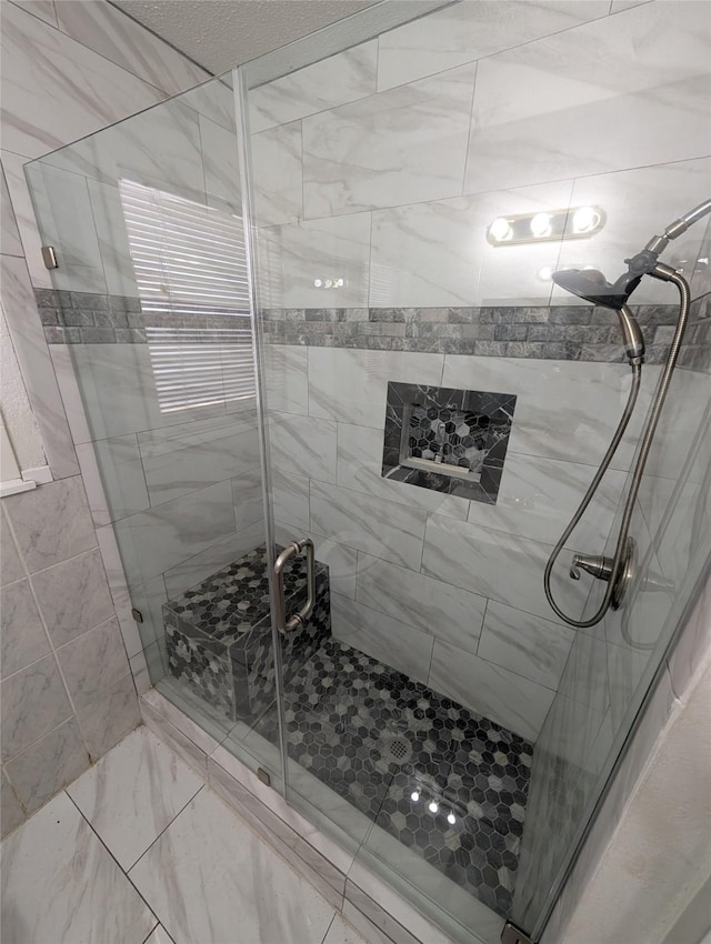 2004 24th St, Galveston, TX 77550 - full bath featuring a shower stall and marble look tile flooring