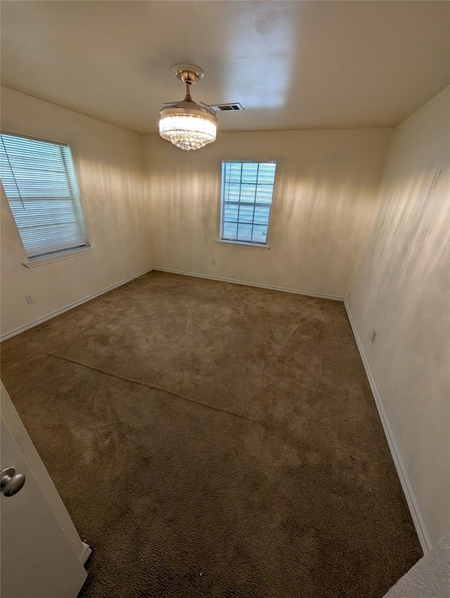 2004 24th St, Galveston, TX 77550 - carpeted spare room with baseboards