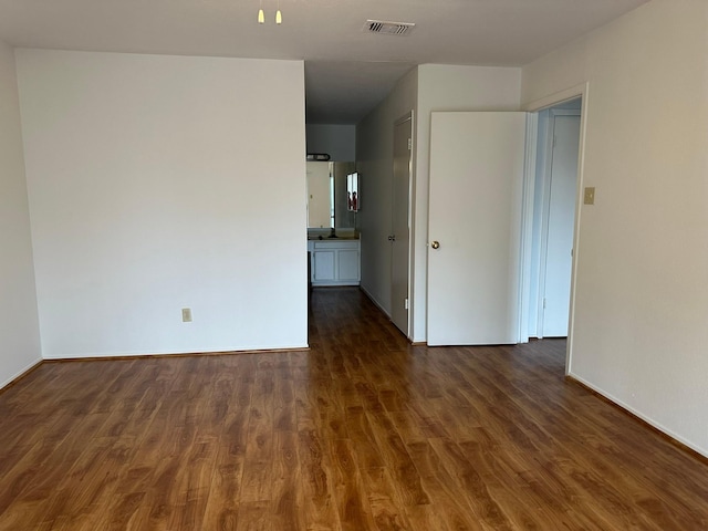 10555 Turtlewood Ct Unit 613, Houston, TX 77072 - empty room featuring dark wood-type flooring and baseboards