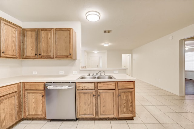 19138 S Whimsey Dr, Cypress, TX 77433 - kitchen featuring stainless steel dishwasher, a peninsula, light tile patterned flooring, and light countertops
