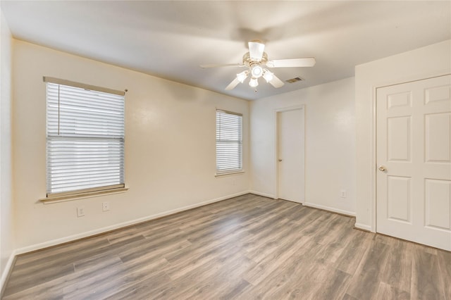 19138 S Whimsey Dr, Cypress, TX 77433 - unfurnished bedroom with wood finished floors and a ceiling fan
