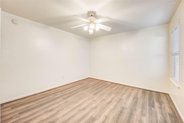 19138 S Whimsey Dr, Cypress, TX 77433 - spare room featuring light wood-style flooring, a ceiling fan, and a smoke detector