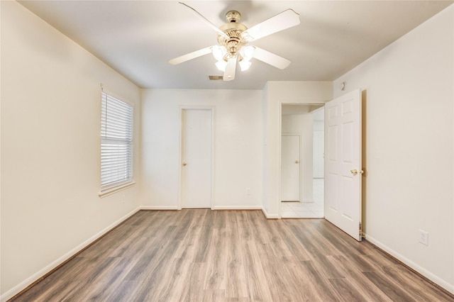 19138 S Whimsey Dr, Cypress, TX 77433 - unfurnished bedroom with wood finished floors and a ceiling fan