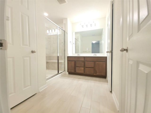 4122 Mossy Bank Ln, Houston, TX 77068 - bathroom with a shower stall and double vanity