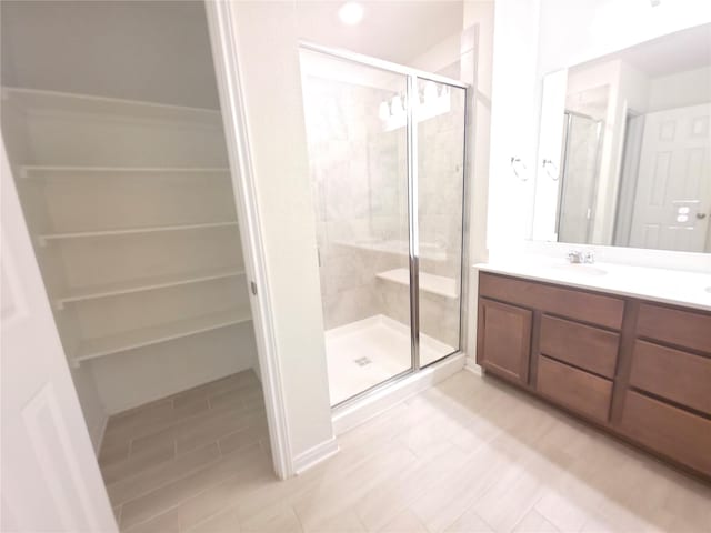4122 Mossy Bank Ln, Houston, TX 77068 - full bath with a shower stall, vanity, and a walk in closet