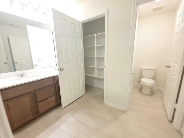 4122 Mossy Bank Ln, Houston, TX 77068 - bathroom with toilet and vanity