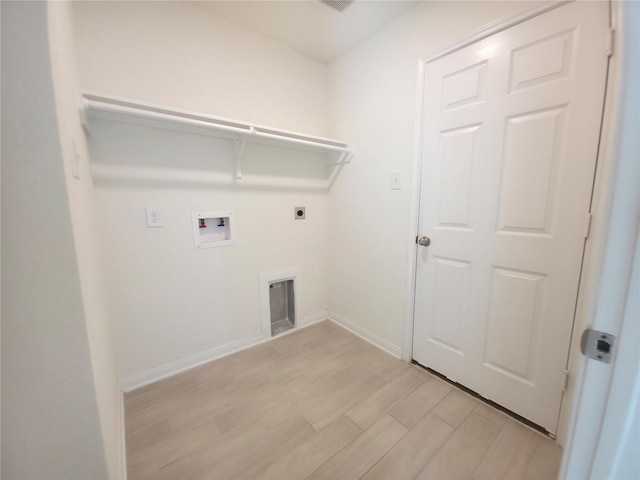 4122 Mossy Bank Ln, Houston, TX 77068 - washroom with washer hookup, electric dryer hookup, and light wood finished floors