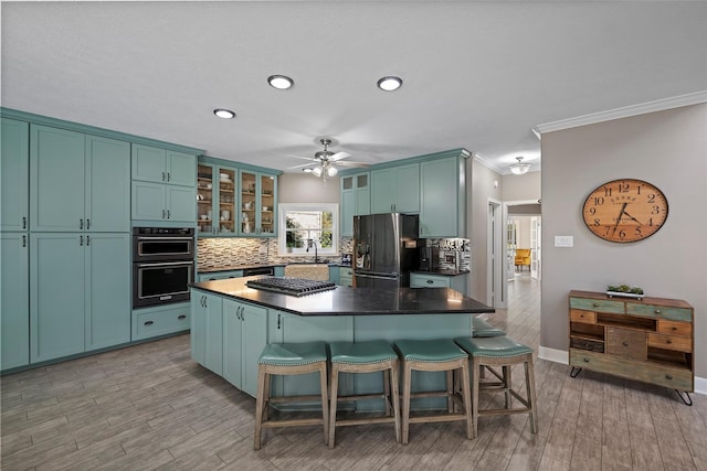 7814 Magnolia Cove Ct, Houston, TX 77346 - kitchen with refrigerator with ice dispenser, a ceiling fan, tasteful backsplash, a kitchen bar, and dark countertops