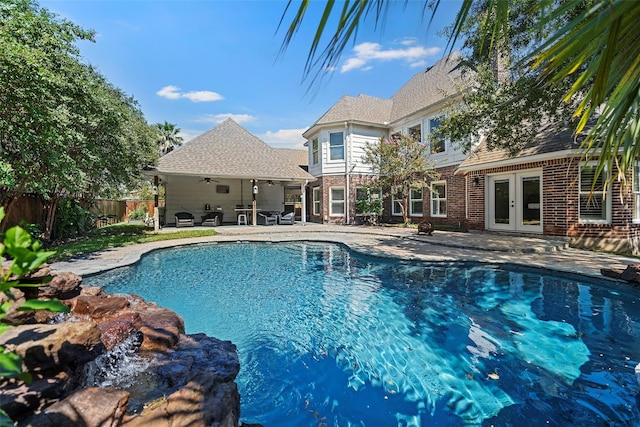 7814 Magnolia Cove Ct, Houston, TX 77346 - view of swimming pool featuring french doors, ceiling fan, and a patio area
