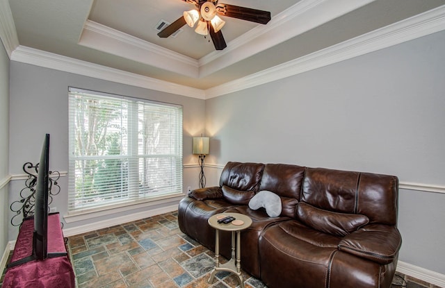 16506 Dawson Mill Ct, Houston, TX 77095 - living area with stone finish flooring, healthy amount of natural light, a ceiling fan, a raised ceiling, and crown molding