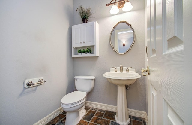 16506 Dawson Mill Ct, Houston, TX 77095 - bathroom featuring toilet and stone tile flooring