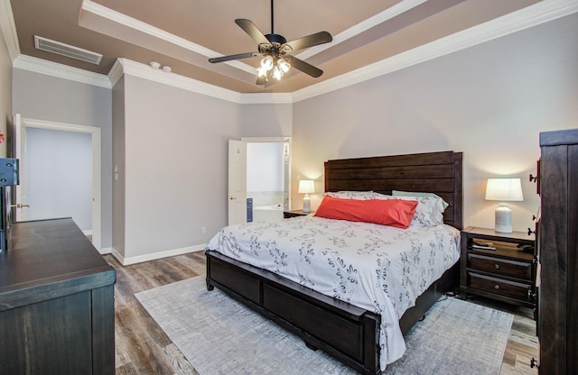 16506 Dawson Mill Ct, Houston, TX 77095 - bedroom with a raised ceiling, wood finished floors, ornamental molding, and a ceiling fan
