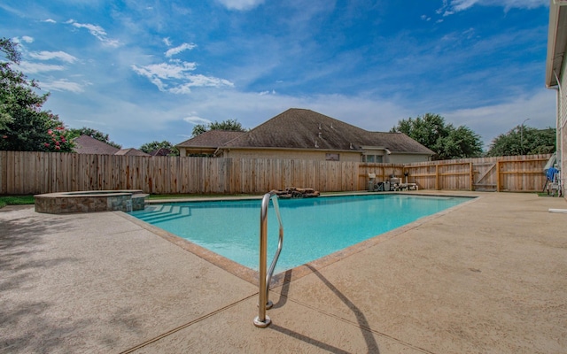 16506 Dawson Mill Ct, Houston, TX 77095 - view of pool featuring a patio area, a fenced backyard, and a pool with connected hot tub