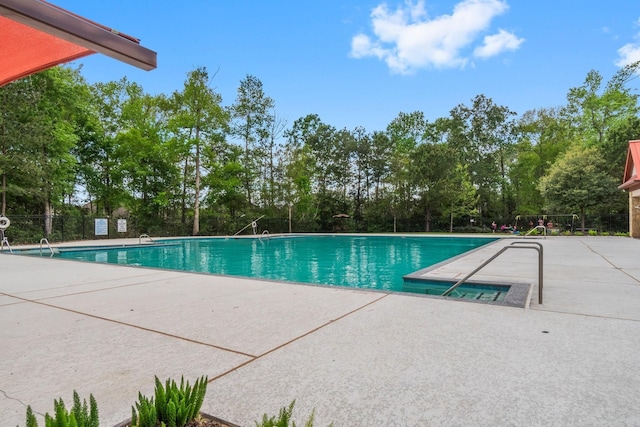 23613 Alder Branch Ln, New Caney, TX 77357 - community pool with a patio area and view of scattered trees
