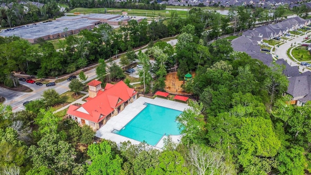 23613 Alder Branch Ln, New Caney, TX 77357 - drone / aerial view of a pool area and a tree filled landscape
