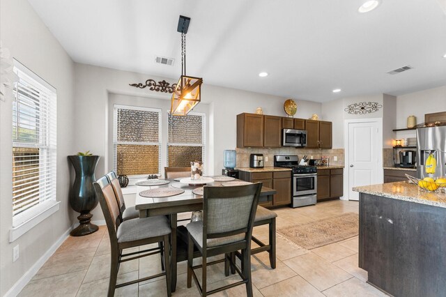 6923 Glenmoor Dr, Rosharon, TX 77583 - dining space featuring light tile patterned flooring and recessed lighting