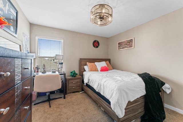 6923 Glenmoor Dr, Rosharon, TX 77583 - bedroom with light colored carpet and a chandelier