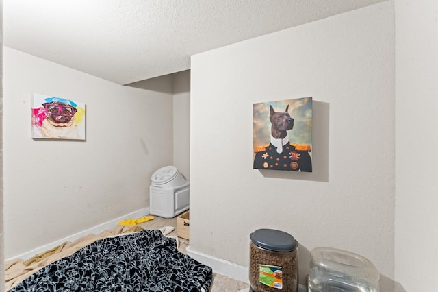 6923 Glenmoor Dr, Rosharon, TX 77583 - bedroom featuring a textured ceiling and light tile patterned flooring
